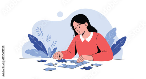 Young woman concentrates as she sits at a table and puts together the pieces of a blue jigsaw puzzle for relaxation.