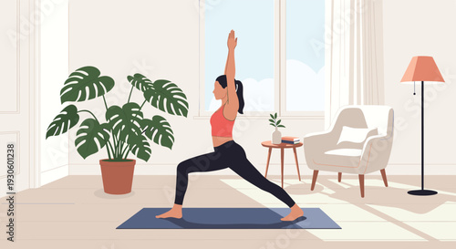 Young woman practices yoga in a warrior pose on a blue mat in her bright and airy living room for wellness and fitness.