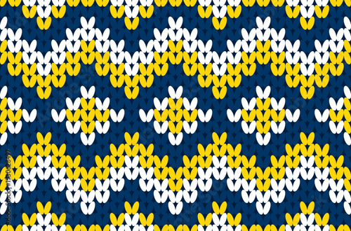Seamless native ethnic zigzag knitted pattern in blue and yellow tones.