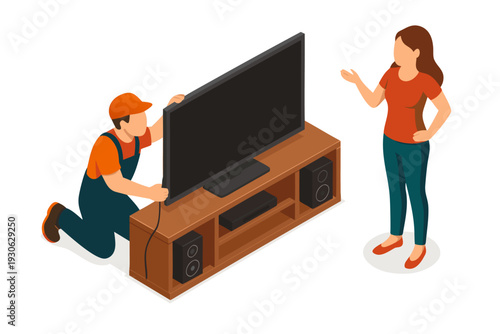 A technician installing a large screen TV for a satisfied customer