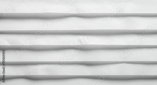 White fabric texture with horizontal folds and soft creases.