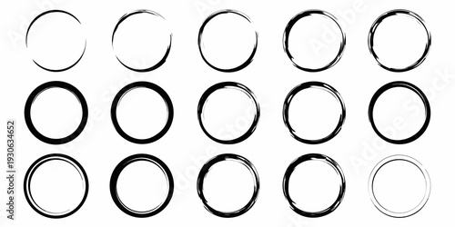 Arrangement of black circles and rings on a white background
