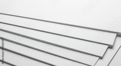 White metal sheets stacked on top of each other.