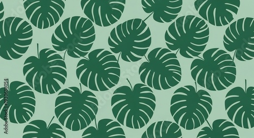 Tropical monstera leaves pattern on green background.