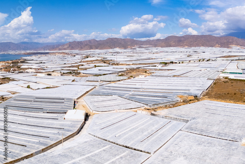 фотографія greenhouse mountain invernaderos elysium intensive summer farming plastic sea ag