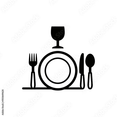 Elegant Black and White Table Setting with Glass, Fork, Knife, and Spoon