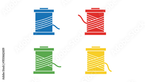 Four colorful spools of thread with loose ends