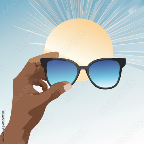 Person holding sunglasses with a stylized sun in the background