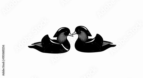 Two black and white mandarin ducks facing each other in a symbolic pose