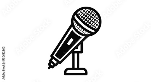 A black microphone stands prominently on a stand a striking silhouette