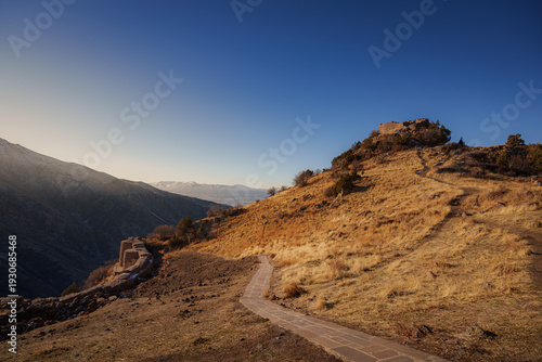 Stone Path Leading Toward Ancient Fortress Ruins
