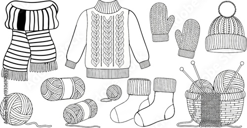 Various knitted winter clothing and yarn balls