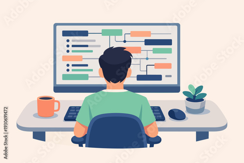Person programming at a desk, designing software architecture with data flow diagram