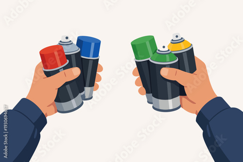 Hands holding colorful spray paint cans for creative graffiti street art