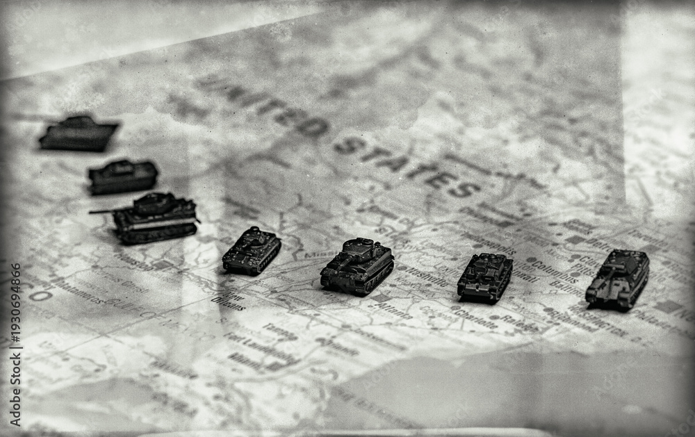 Naklejka premium Miniature military tanks on map representing USA national defense.