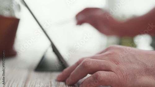 Businessman hands using stylus to sign document on digital device