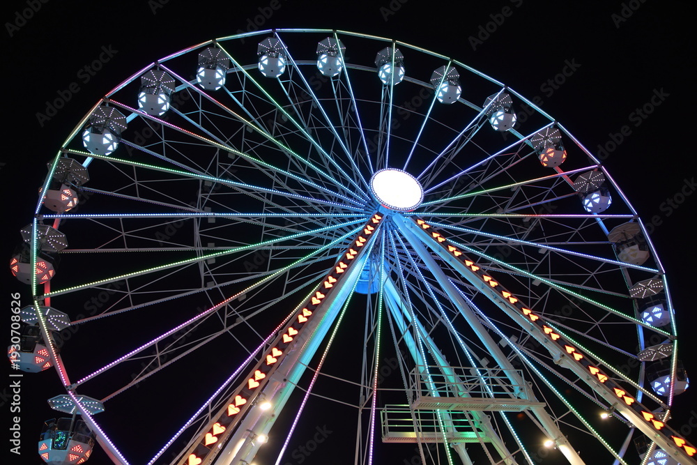 Fototapeta premium Night Carnival at Ohio State Fair with Neon Rides and Colorful Lights