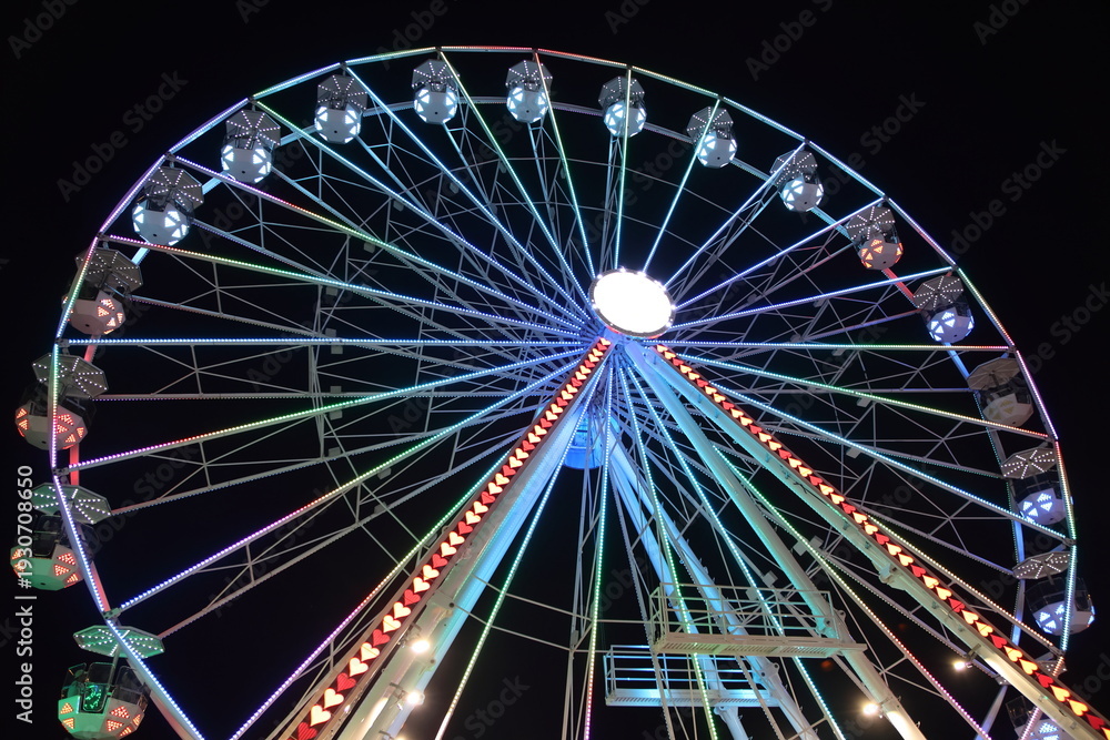 Fototapeta premium Night Carnival at Ohio State Fair with Neon Rides and Colorful Lights