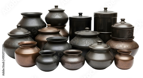 Collection of traditional metal containers with lids in various sizes and designs
