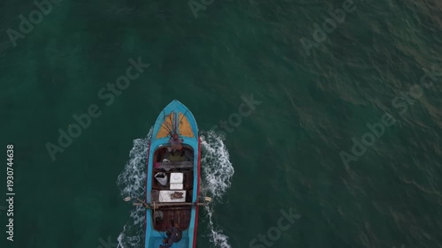 Aerial view of traditional fishing boats floating in clear blue ocean near Sri Lanka coast
