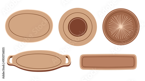 Collection of top view brown ceramic and wooden trays and plates in various shapes including round oval and rectangular.