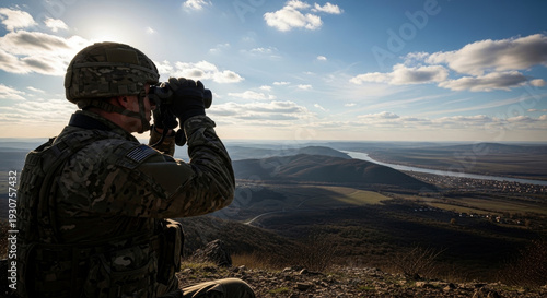 Soldier Uses Binoculars to Observe Distant Landscape