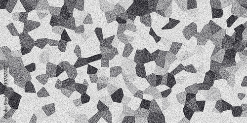 Mosaic-like abstract pattern of irregular geometric shapes in varying shades of gray and black, overlaid with a subtle speckled noise texture for a granular effect