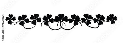 A decorative row of lucky black four-leaf clovers and shamrocks forming an elegant border, perfect for St. Patrick's Day designs, Irish themed events, or adding a touch of good fortune
