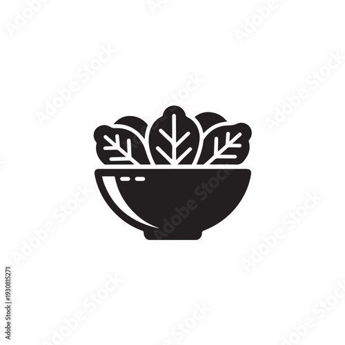 Black silhouette salad bowl with leafy greens