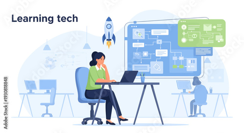 Young woman sitting at a desk learning new technology on a laptop.