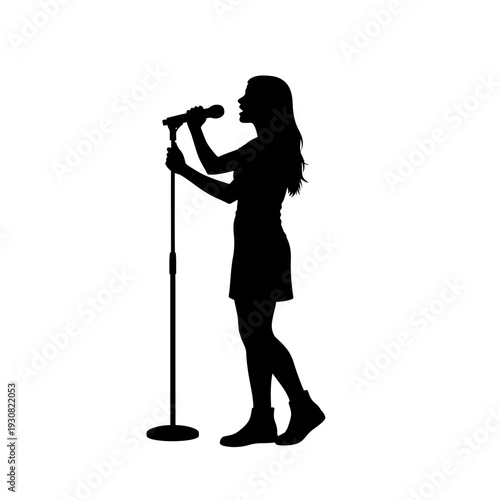Silhouette of a female singer performing on stage with a microphone under dramatic spotlight.