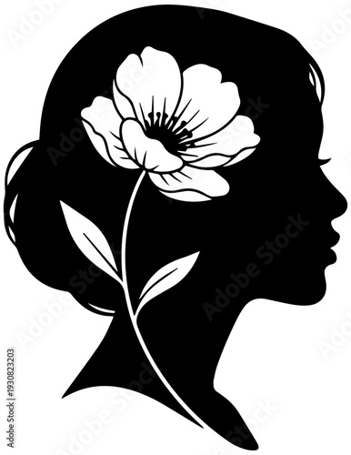 Elegant woman's silhouette with beautiful flower in hair