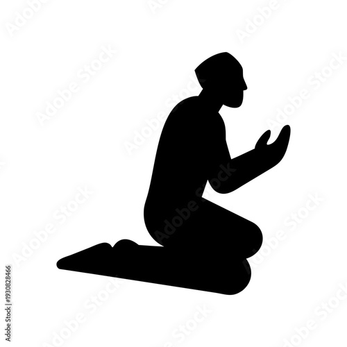 Silhouette of a person in a kneeling prayer position