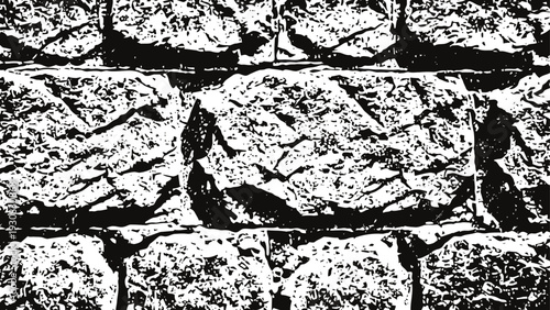 rough stone wall texture with irregular bricks and mortar gaps in black and white contrast