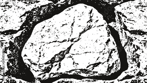 Large cracked stone rock on rough natural ground surface close up textured background