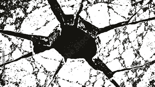 Cracked concrete surface with radial fractures and central impact point pattern damage