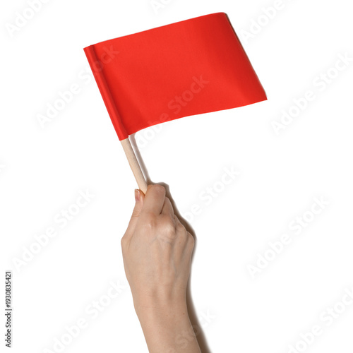 Hand holding small red flag isolated on transparent background. Warning, alert, protest and signaling concept. PNG cutout object.