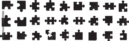 Collection of various black puzzle pieces on a grey checkered background