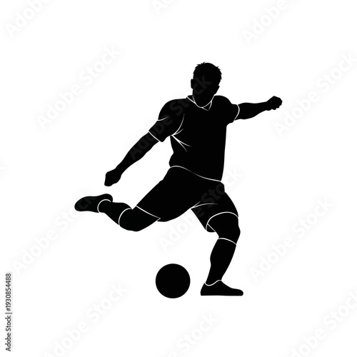 Silhouette of a soccer player kicking a ball during game action.