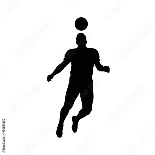 Silhouette of a person juggling a ball in midair, capturing a dynamic sports moment.
