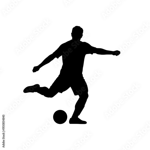 Silhouette of a Soccer Player in Action Kicking a Ball.