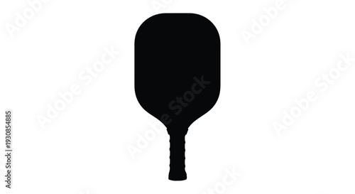 Black pickleball paddle against a white background a stark silhouette