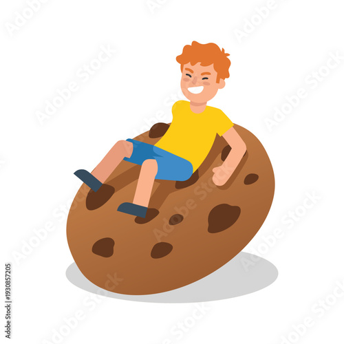 Boy Sitting on a Giant Chocolate Chip Cookie.