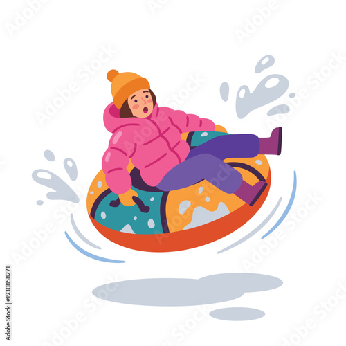 Child enjoying winter tubing down a snowy hill.