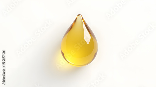 A single droplet of golden oil glistens against a clean white background, creating a sense of purity and richness.
