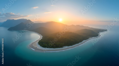 A breathtaking aerial view of a tropical island at sunrise, showcasing lush greenery and tranquil turquoise waters.