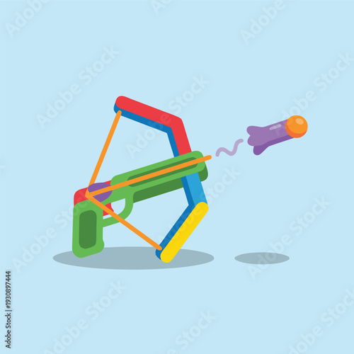 Colorful toy crossbow shooting a purple dart.
