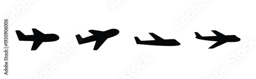 Collection of four black airplane icons in different poses
