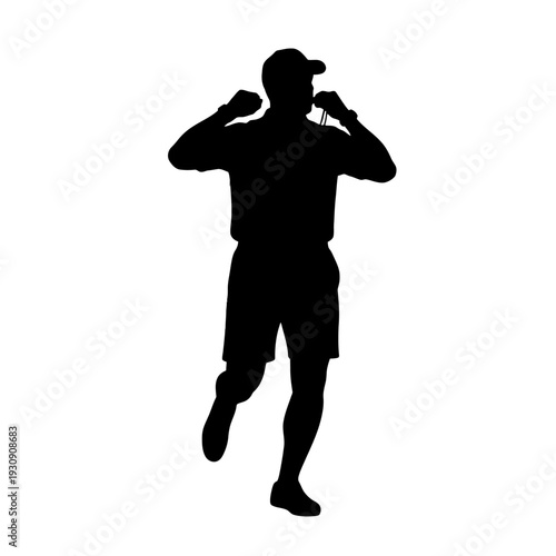 Silhouette of a person walking and talking on a mobile phone.