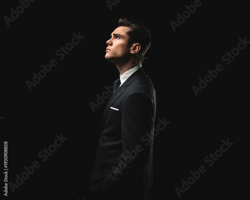 Side view of focused man looking up